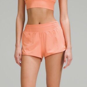 Lululemon hotty hot shorts in color coral kiss. 4 inch, Size 2.